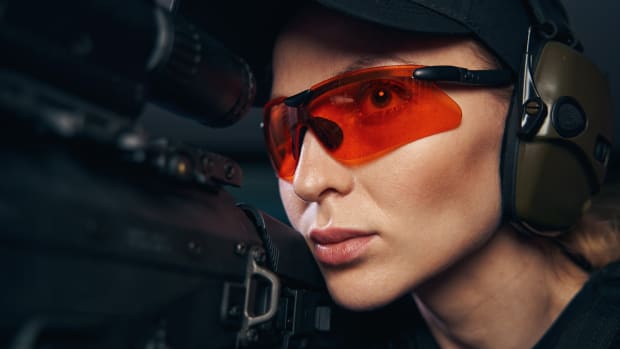 young-shooter-in-safety-glasses-firing-a-weapon-2021-09-04-14-27-12-utc
