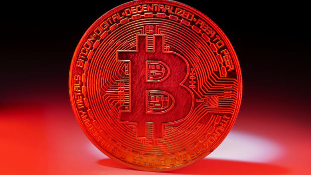 a-coin-with-bitcoin-symbol-on-red-light-concept-o-2022-12-16-03-05-59-utc