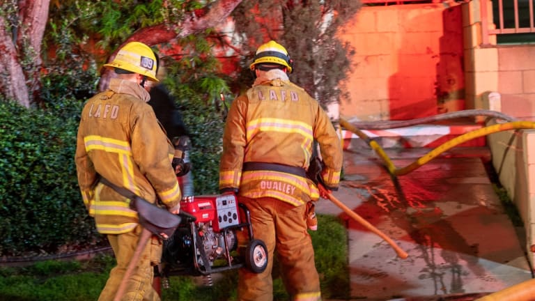 Firefighters Battle Stubborn Fire in Walls of 2-Story Encino Apartment Building