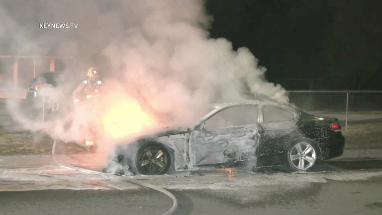 Firefighters Battle Burning BMW Sedan in Sylmar