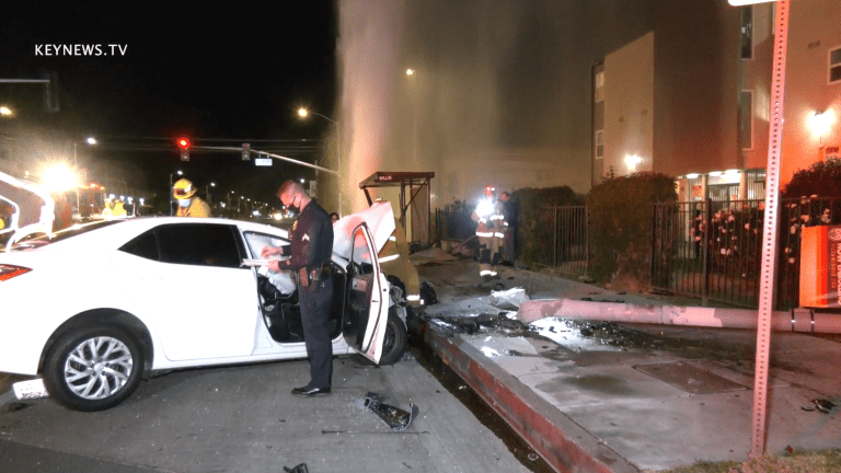 Vehicle Collision Involves Downed Light Pole, Gushing Hydrant