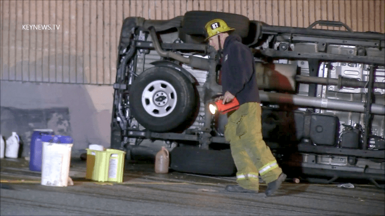 Hazmat Responds to Chemical Leak from Containers at Vehicle Rollover Incident