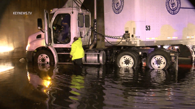 Big Rig and Sedan Collide on Flooded I-5 Freeway in DTLA