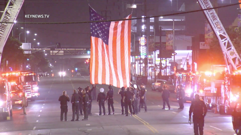 Vehicle Procession Escorts Slain Firefighter to Coroners Office in Boyle Heights