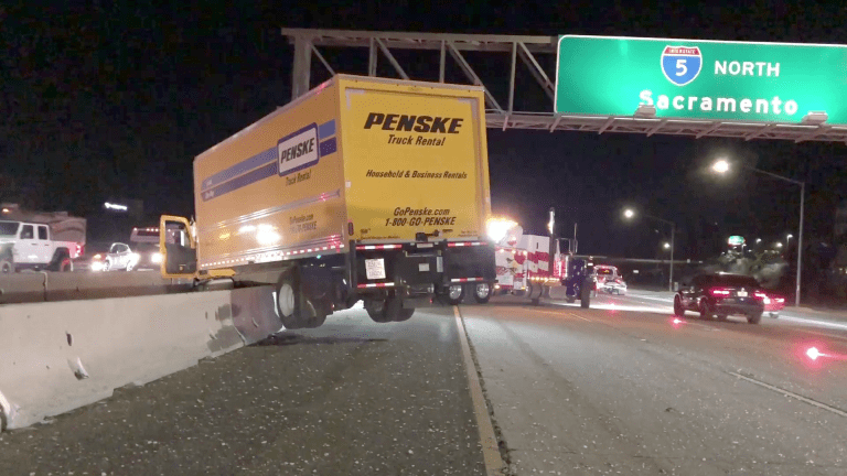 Penske Truck Over Center Divider on I-5 Freeway