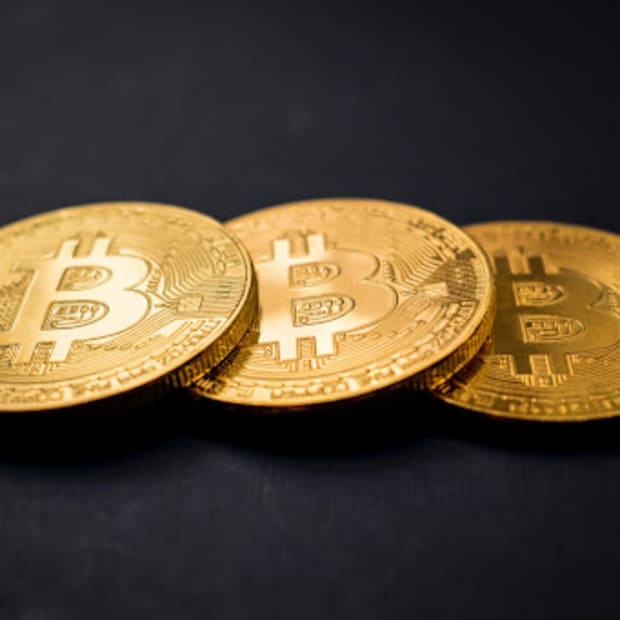 Three gold bitcoins