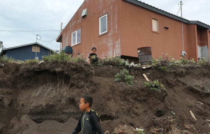 In parts of Alaska, thawing permafrost is eroding hillsides and causing ground to sink, putting homes, roads and pipelines at risk.