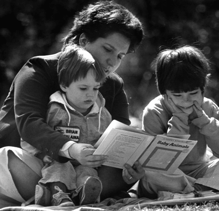Former Finders member Paula Arico and her children John Paul, 2, and Mary, 7, enjoy the sunshine in the backyard of their apartment in Tallahassee.