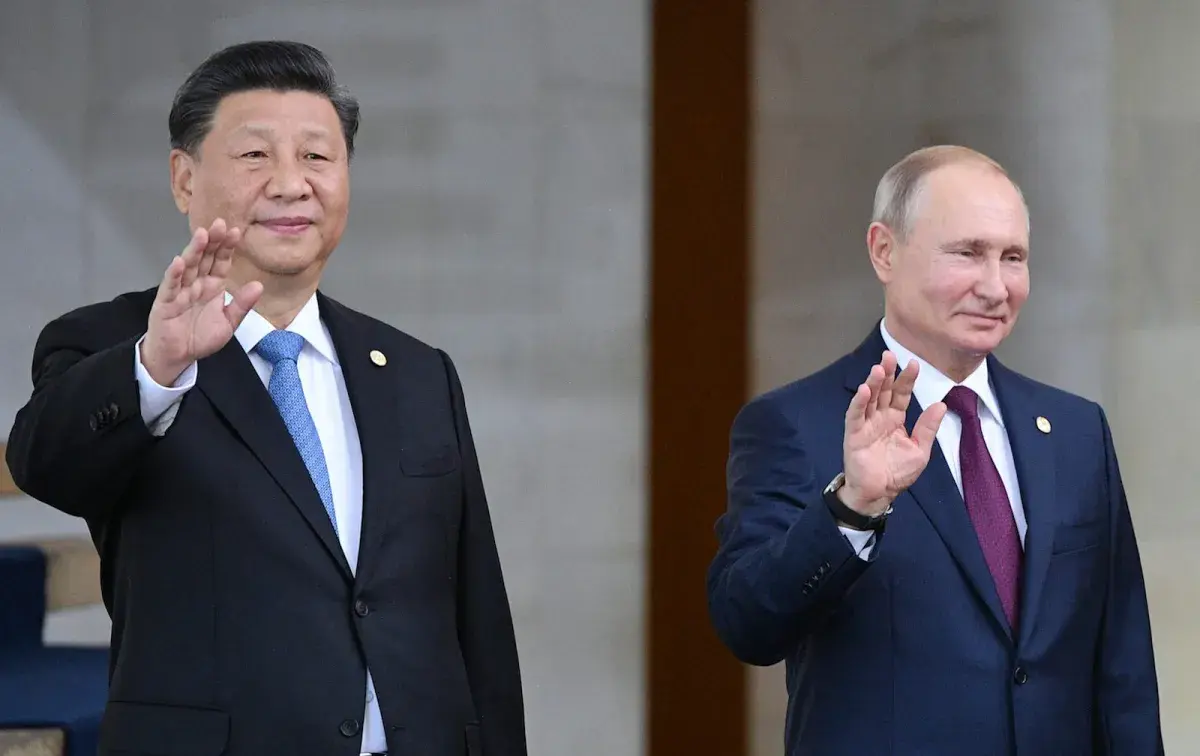 Chinese President Xi Jinping and Russian President Vladimir Putin pose for a family photo at the 11th BRICS leaders summit in Brasilia, Brazil, in 2019. Photo: Sputnik / Ramil Sitdikov