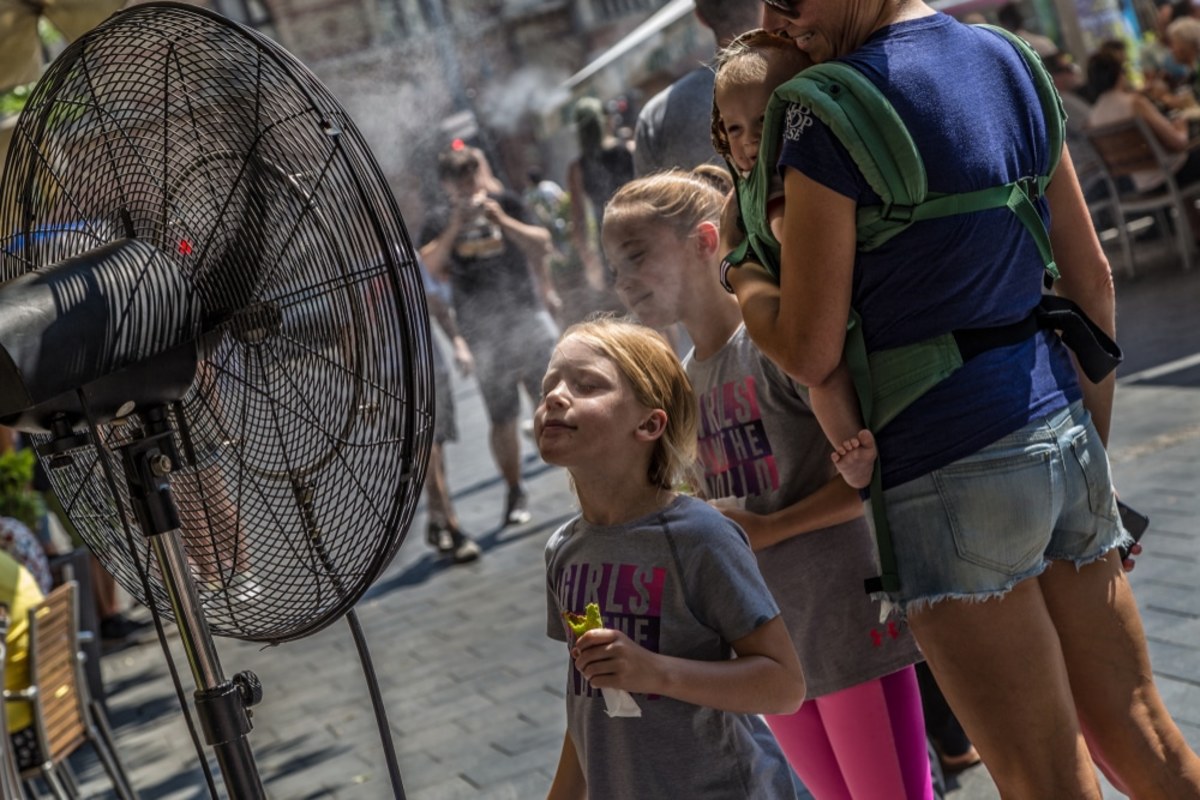 Child cools off in a heat wave. 
