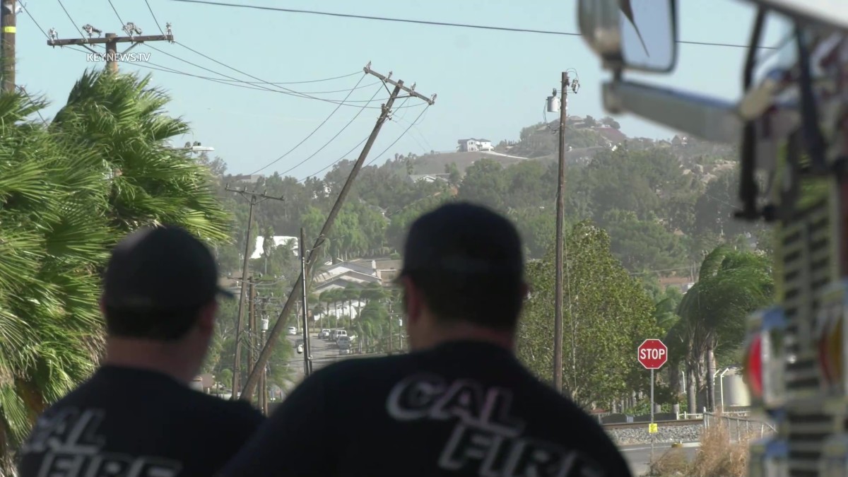 Utility Pole Snapped by Strong Winds Prompts Closure of Busy Street in